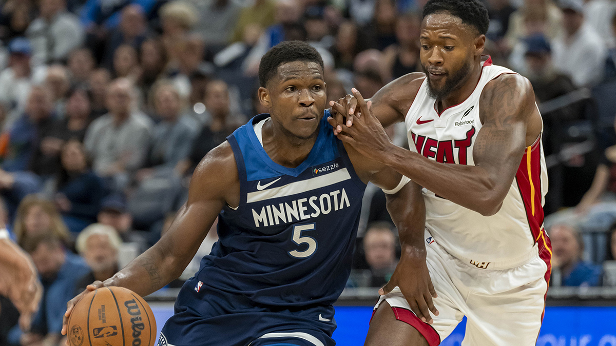 Minnesota Timberwolves guard Anthony Edwards (5) drives to the basket past Miami Heat forward Haywood Highsmith (24) in the first half at Target Center.