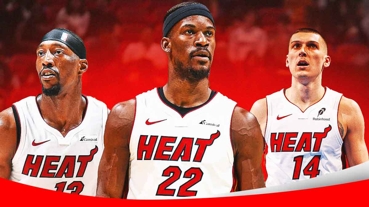 Miami Heat star Jimmy Butler in the middle of Bam Adebayo and Tyler Herro in front of Kaseya Center.