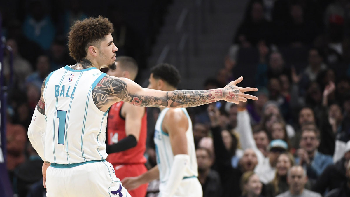 Hornets guard LaMelo Ball (1) reacts after scoring a three point basket during the first half against the Miami Heat at the Spectrum Center