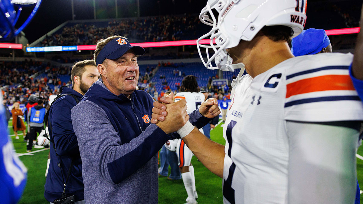 Auburn Tigers head coach Hugh Freeze celebrates with quarterback Payton Thorne (1) after the game at Kroger Field.