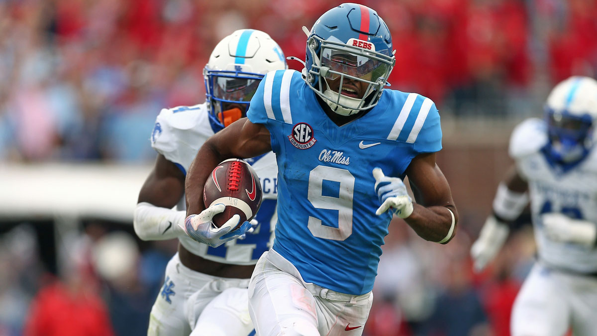 Mississippi Rebels wide receiver Tre Harris (9) runs after a catch for a first down as Kentucky Wildcats defensive back Jordan Lovett (25) pursues during the second half at Vaught-Hemingway Stadium.