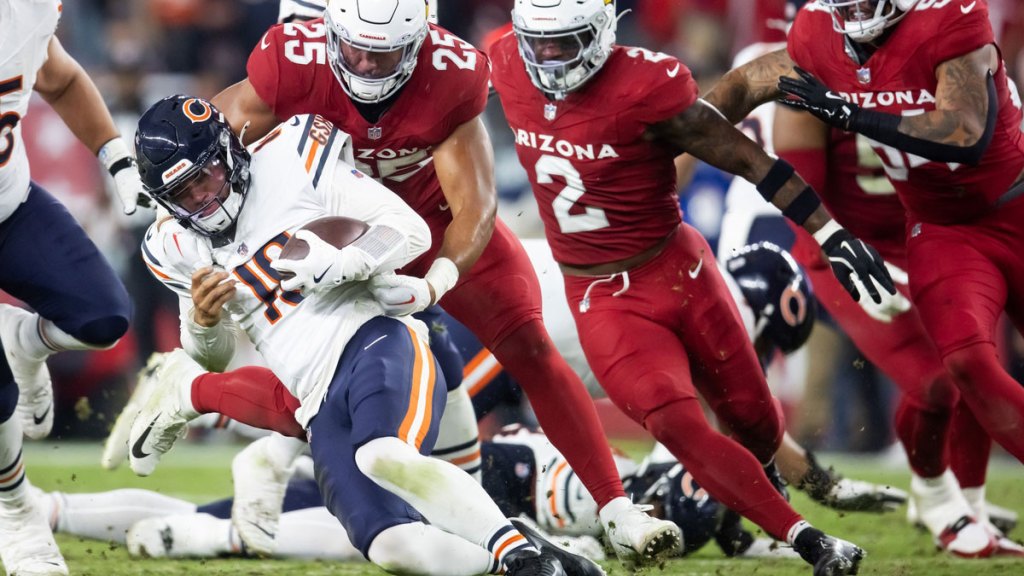 Chicago Bears quarterback Caleb Williams (18) is sacked by Arizona Cardinals linebacker Zaven Collins (25) in the second half at State Farm Stadium.