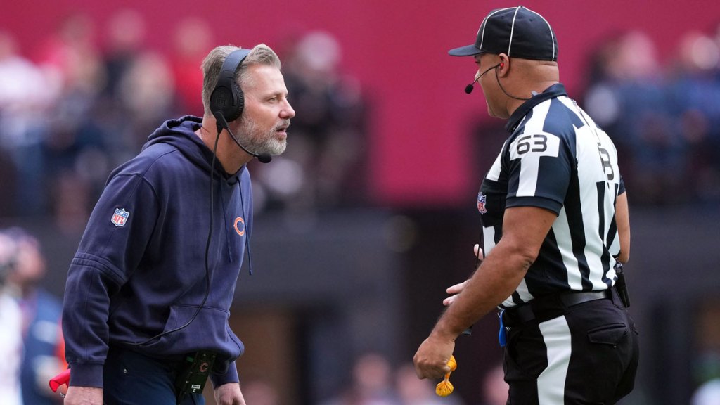 Chicago Bears head coach Matt Eberflus argues a call with down judge Mike Carr (63) during the first half against the Arizona Cardinals at State Farm Stadium.
