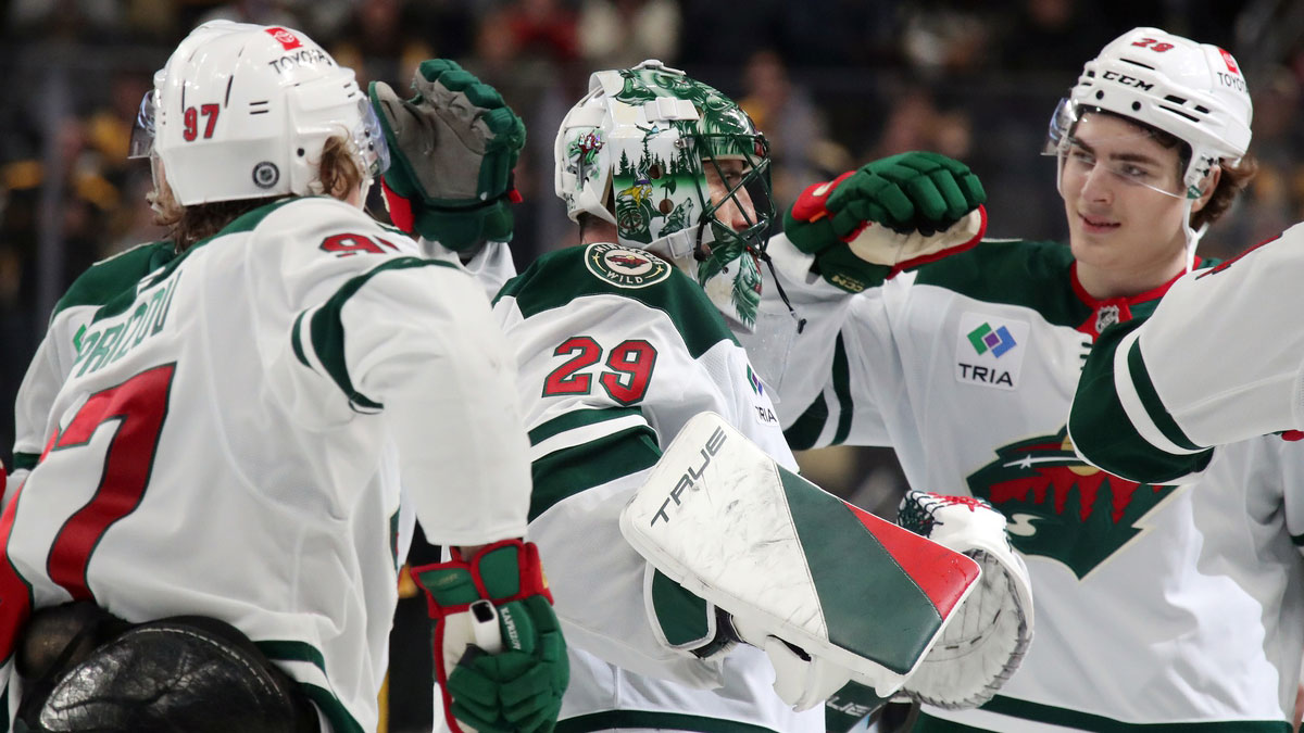 Minnesota Wild goaltender Marc-Andre Fleury (29) is congratulated by teammates after taking a victory lap in honor of his last game in Pittsburgh and defeating the Pittsburgh Penguins at PPG Paints Arena. Fleury began his career with the Penguins earning three Stanley Cups in Pittsburgh.