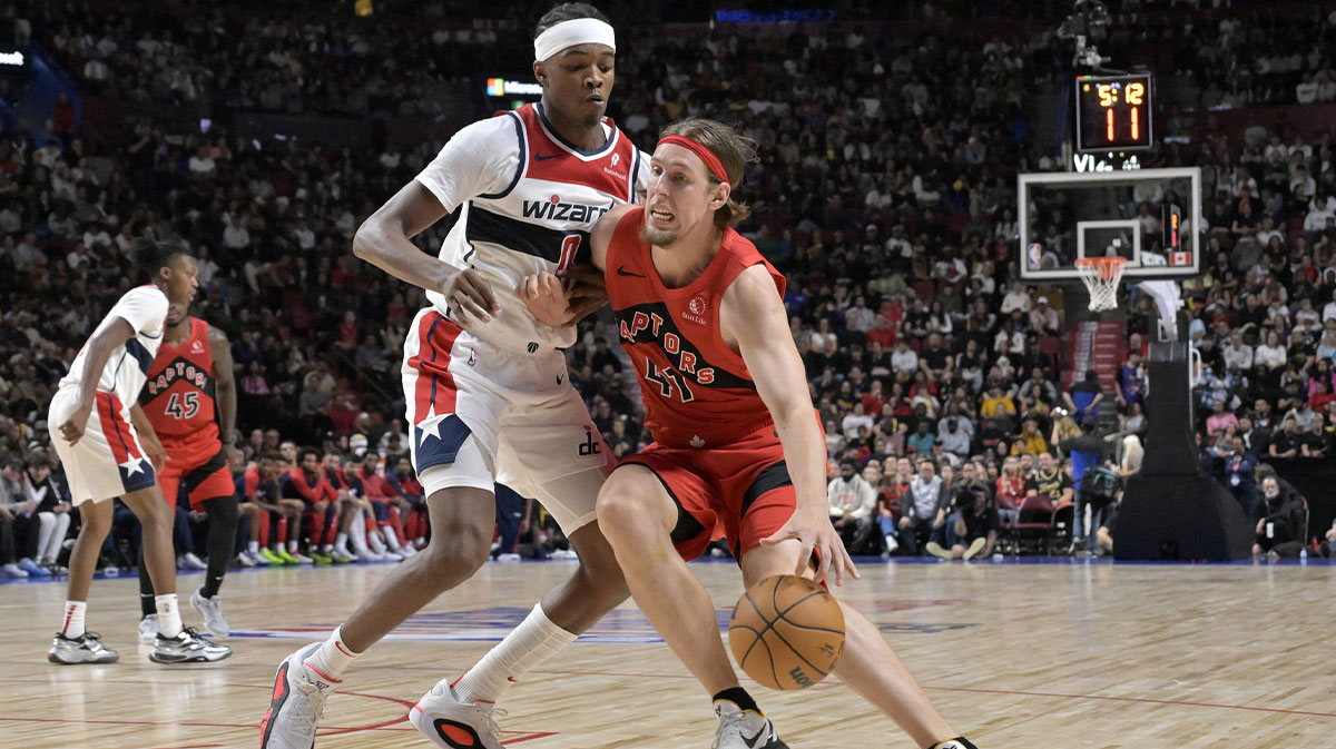 Toronto Raptors power forward Kelly Olynyk (41) dribbles and Washington Wizards small forward Justin Champagnie (9) defends during the third quarter at the Bell Centre.