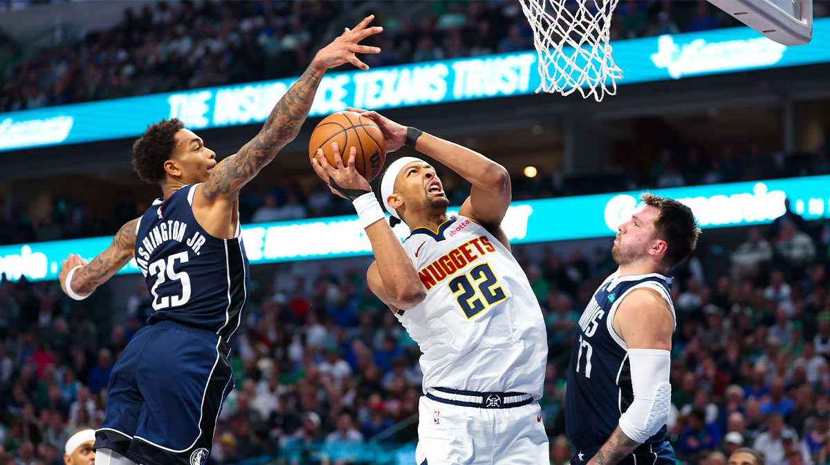 Denver Nuggets forward Zeke Nnaji (22) looks to shoot as Dallas Mavericks forward P.J. Washington (25) and Dallas Mavericks guard Luka Doncic (77) defend during the second quarter at American Airlines Center.