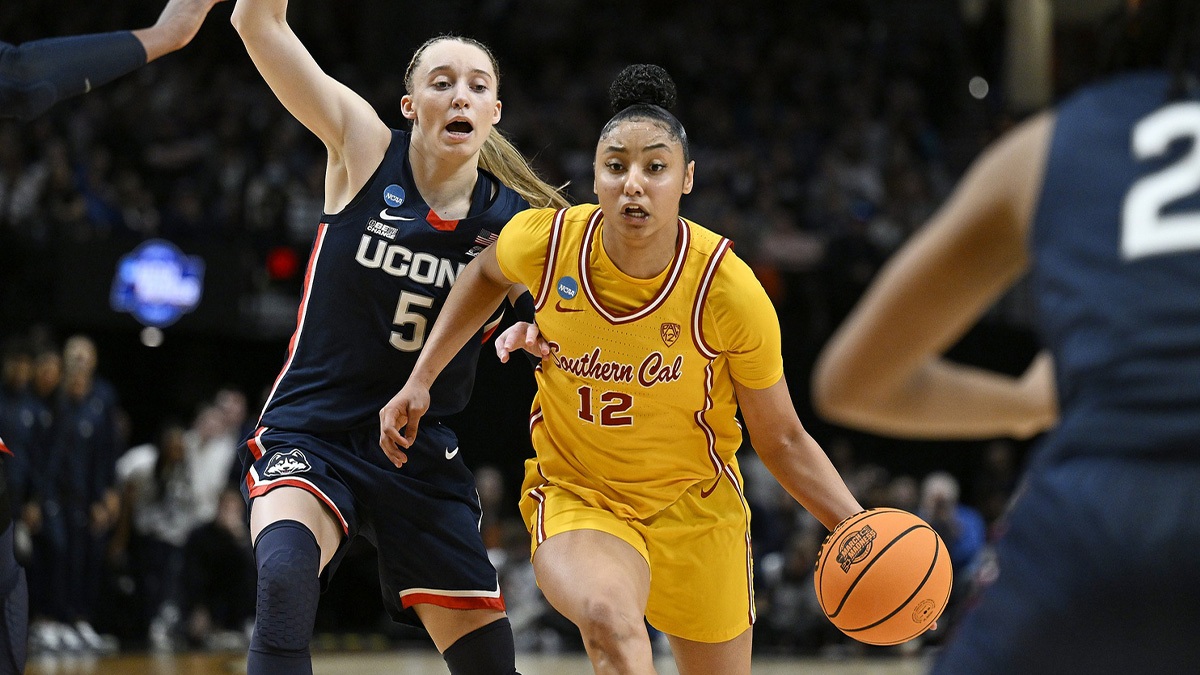 USC Trojans guard JuJu Watkins (12) drives to the basket during the second half against UConn Huskies guard Paige Bueckers (5) in the finals of the Portland Regional of the NCAA Tournament at the Moda Center.