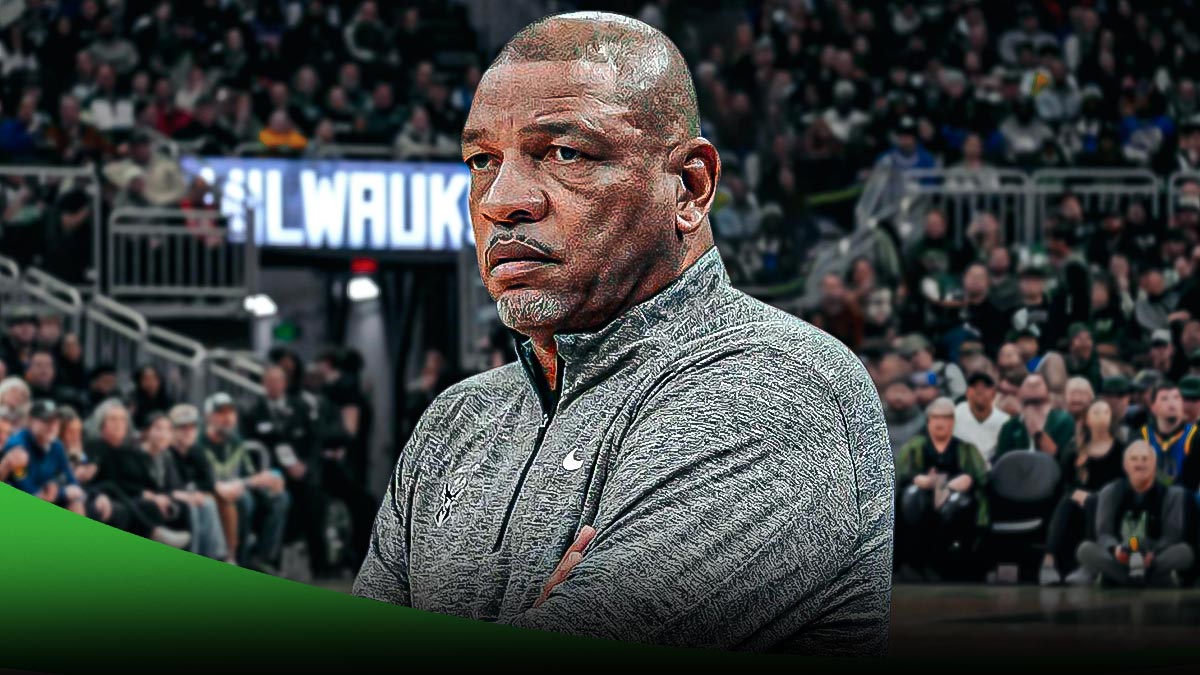 Milwaukee Bucks coach Doc Rivers with the Bucks arena in the background, refs