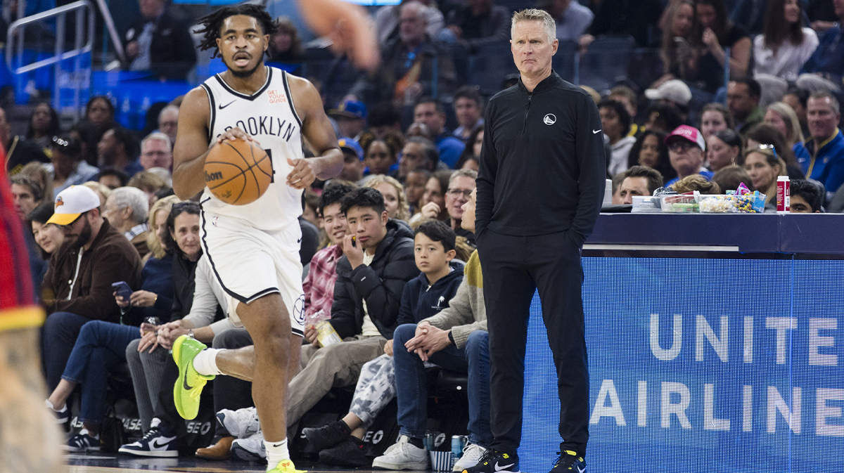 Brooklyn Nets guard Cam Thomas (24) dribbles in front of Golden State Warriors head coach Steve Kerr during the first half at Chase Center.