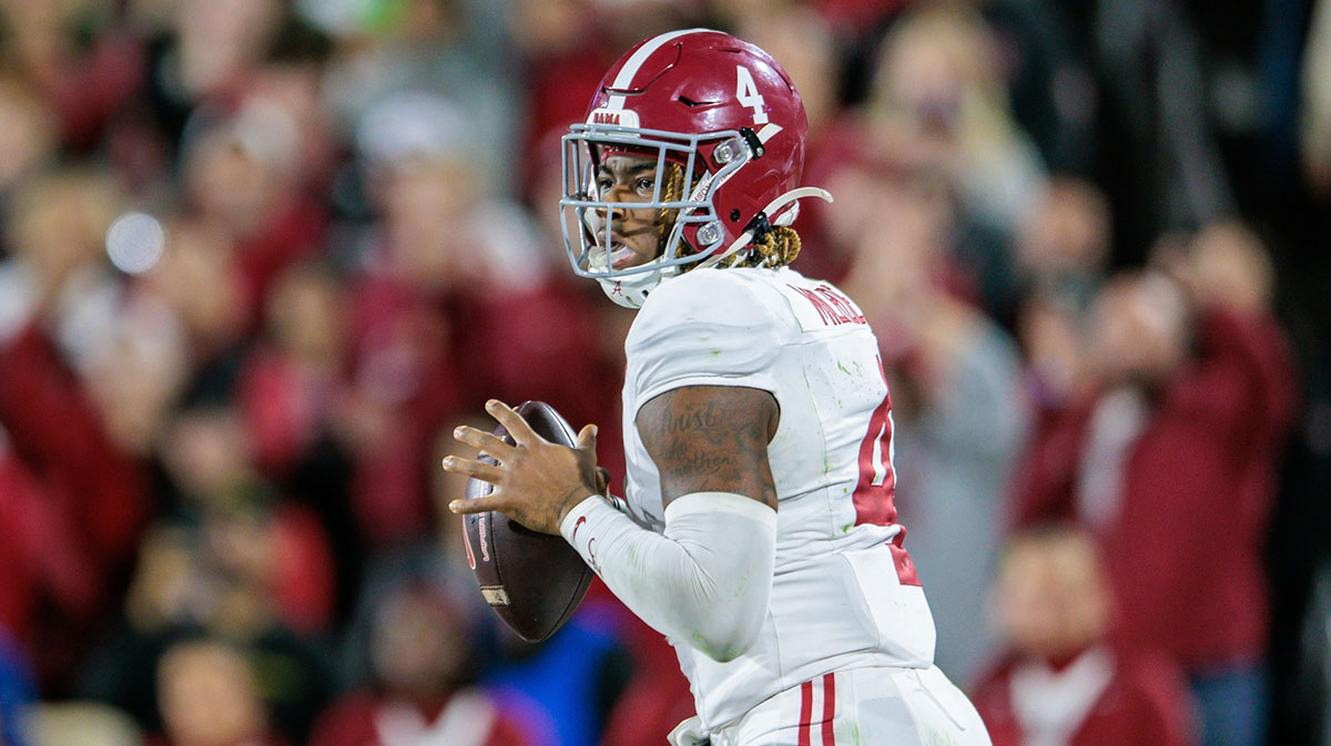Nov 23, 2024; Norman, Oklahoma, USA; Alabama Crimson Tide quarterback Jalen Milroe (4) passes the ball during the fourth quarter against the Oklahoma Sooners at Gaylord Family-Oklahoma Memorial Stadium.