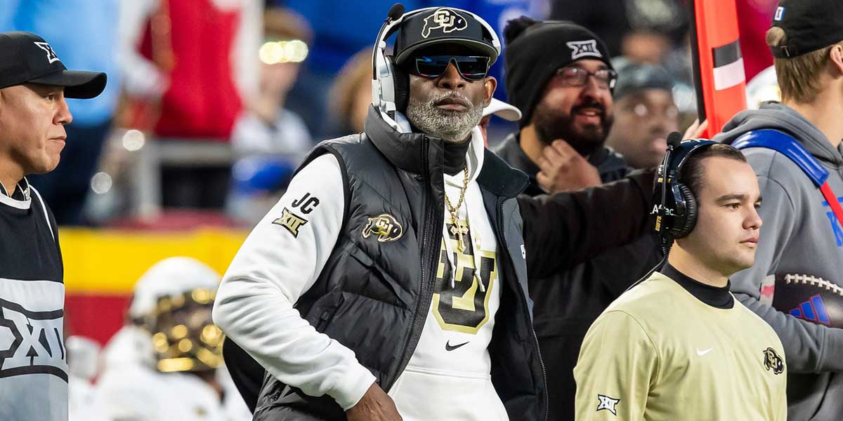 Colorado head coach Deion Sanders watches the run of play during the 3rd quarter between the Kansas Jayhawks and the Colorado Buffaloes at GEHA Field at Arrowhead Stadium.