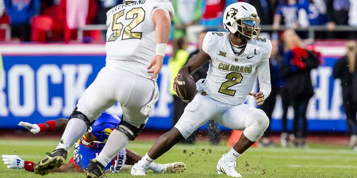 Colorado quarterback Shedeur Sanders (2) attempts to avoid a sack during the 3rd quarter game between the Kansas Jayhawks and the Colorado Buffaloes at GEHA Field at Arrowhead Stadium.