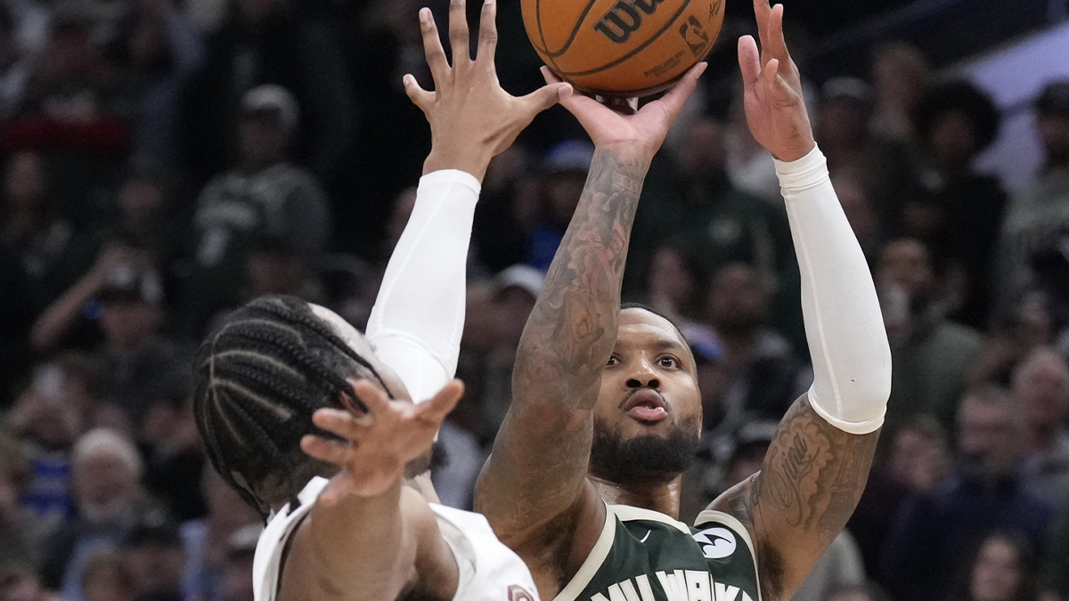 Milwaukee Bucks guard Damian Lillard (0) puts up a shot against Cleveland Cavaliers forward Isaac Okoro (35) in the second half at Fiserv Forum.