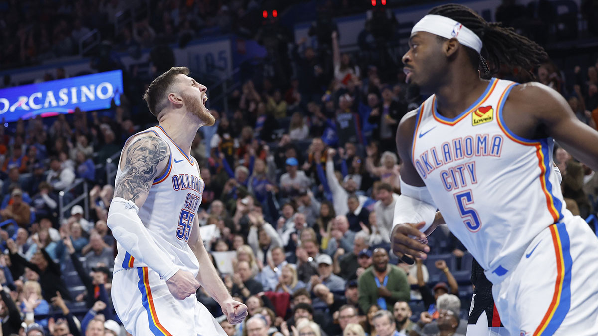 Oklahoma City Thunder center Isaiah Hartenstein (55) celebrates a dunk between Portland Trail Blazers center Donovan Clingan (23) and forward Toumani Camara (33) during the second half at Paycom Center.