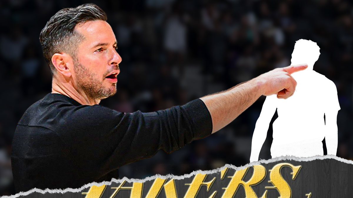 Image of Lakers coach JJ Redick smiling and pointing at a silhouette of Lakers guard Max Christie