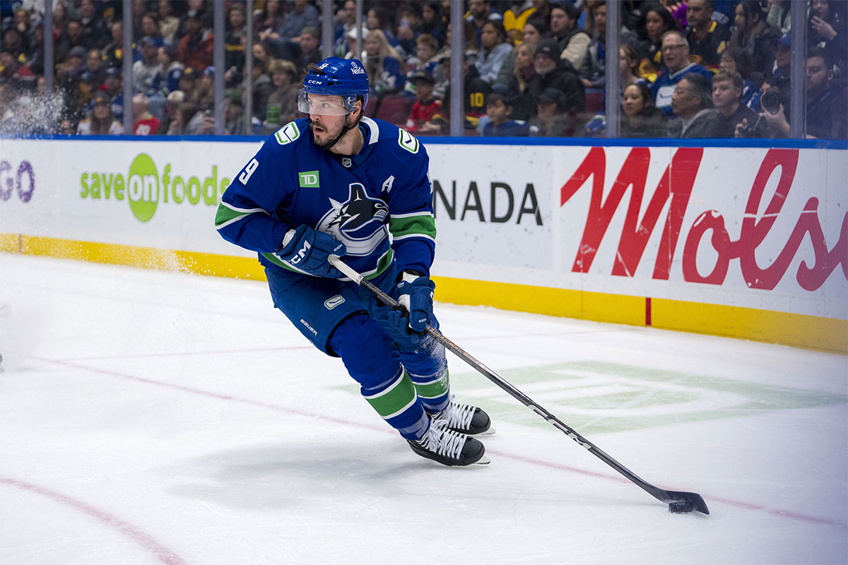 Vancouver Canucks forward J.T. Miller (9) handles the puck against the Chicago Blackhawks during the first period at Rogers Arena.