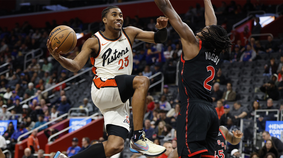 Detroit Pistons guard Jaden Ivey (23) shoots on Toronto Raptors forward Jonathan Mogbo (2) in the first half at Little Caesars Arena.