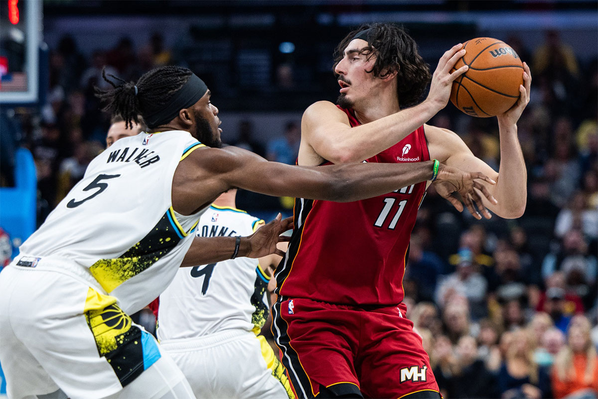 Miami Heat guard Jaime Jaquez Jr. (11) holds the ball while Indiana Pacers forward Jarace Walker (5) defends in the second half at Gainbridge Fieldhouse.