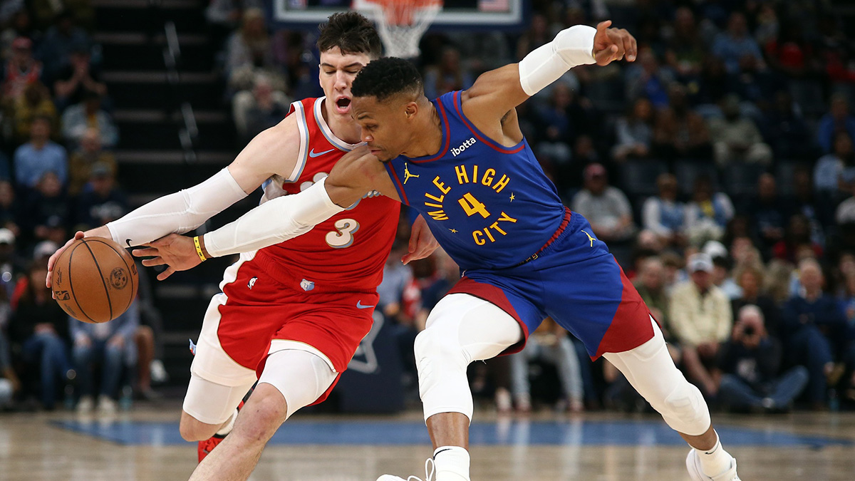 Denver Nuggets guard Russell Westbrook (4) steals the ball from Memphis Grizzlies forward Jake LaRavia (3) during the second half at FedExForum.