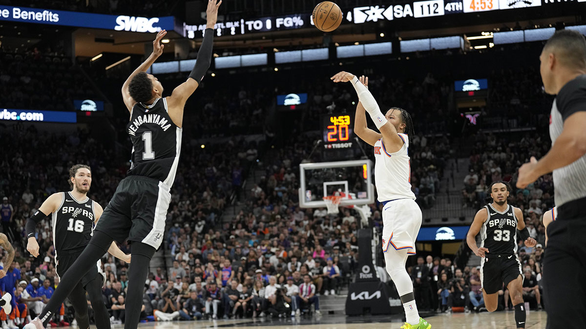 Mar 29, 2024; San Antonio, Texas, USA; New York Knicks guard Jalen Brunson (11) shoots over San Antonio Spurs forward Victor Wembanyama (1) during the second half at Frost Bank Center. Mandatory Credit: Scott Wachter-Imagn Images