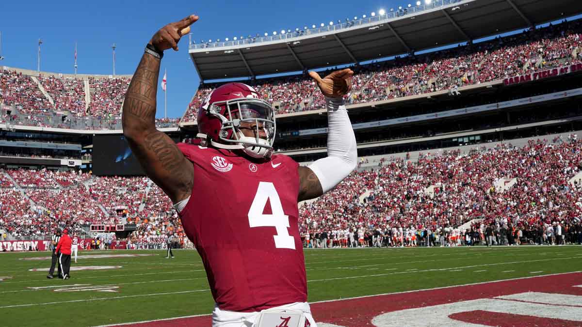 Alabama Crimson Tide quarterback Jalen Milroe (4) gestures to fans before the start of the Crimson Tide game with Mercer at Bryant-Denny Stadium. 