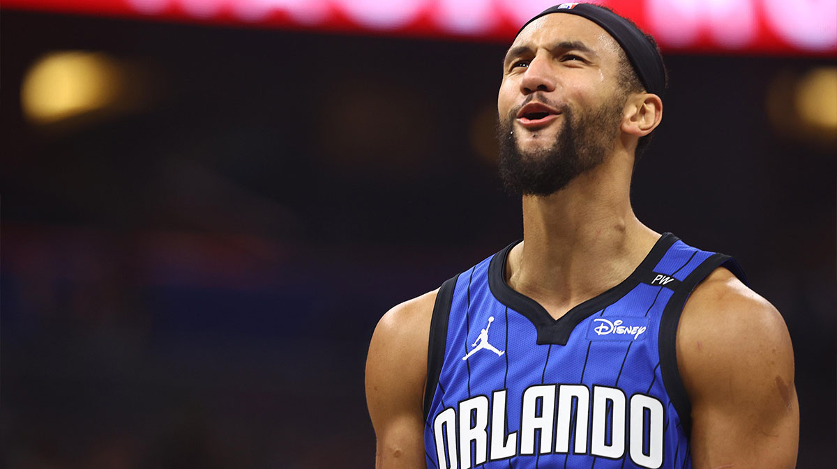 Orlando Magic guard Jalen Suggs (4) celebrates after a three pointer against the Charlotte Hornets during the first quarter at Kia Center.