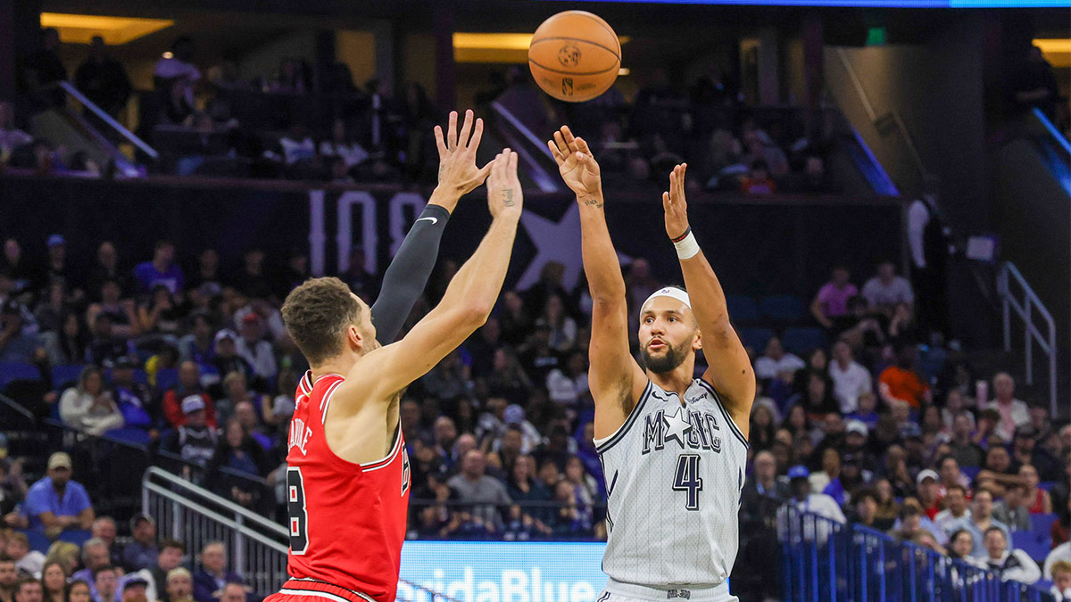 Orlando Magic guard Jalen Suggs (4) shoots the ball against Chicago Bulls guard Zach LaVine (8) during the second quarter at Kia Center.