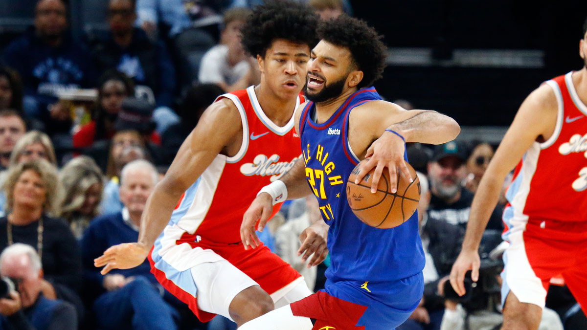 Denver Nuggets guard Jamal Murray (27) drives to the basket as Memphis Grizzlies forward Jaylen Wells (0) defends during the second half at FedExForum. 