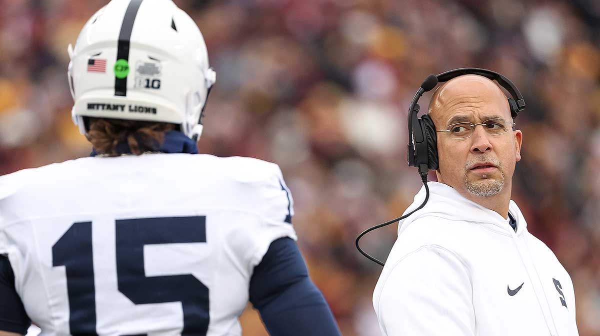 Penn State Nittany Lions head coach James Franklin looks at quarterback Drew Allar (15) during the first quarter against the Minnesota Golden Gophers at Huntington Bank Stadium.