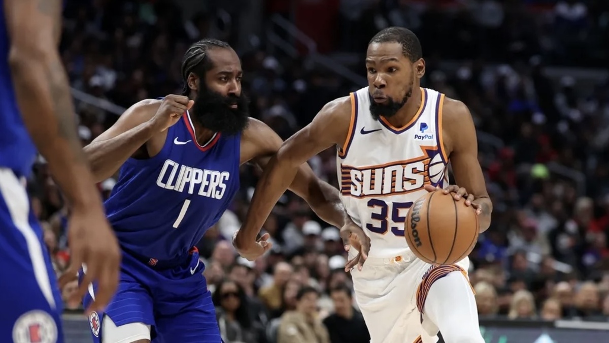 Phoenix Suns forward Kevin Durant (35) dribbles the ball against Los Angeles Clippers guard James Harden (1) during the fourth quarter at Crypto.com Arena.