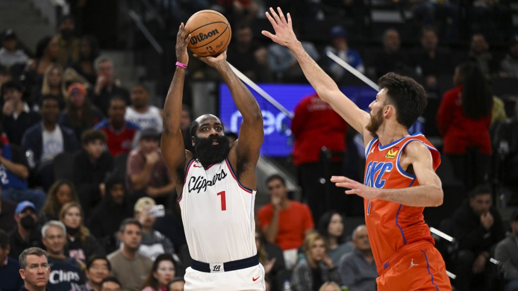 LA Clippers guard James Harden (1) shoots against Oklahoma City Thunder forward Chet Holmgren (7) during the first half at Intuit Dome.