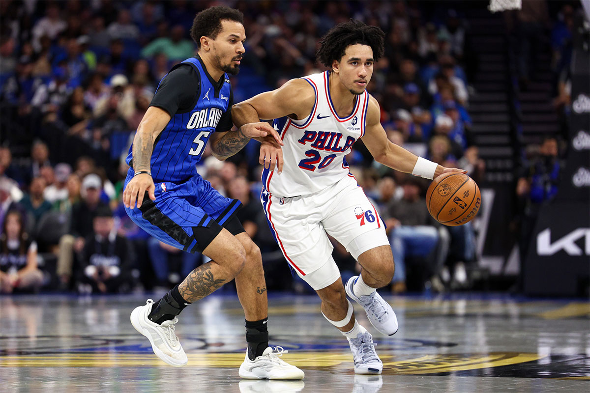 Philadelphia 76ers guard Jared McCain (20) drives to the basket past Orlando Magic guard Cole Anthony (50) in the second quarter at Kia Center.