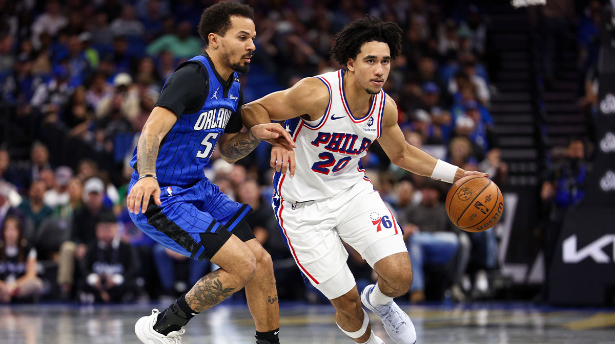 Philadelphia 76ers guard Jared McCain (20) drives to the basket past Orlando Magic guard Cole Anthony (50) in the second quarter at Kia Center.