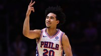 Philadelphia 76ers guard Jared McCain (20) reacts after scoring against the Miami Heat during the first quarter at Kaseya Center.