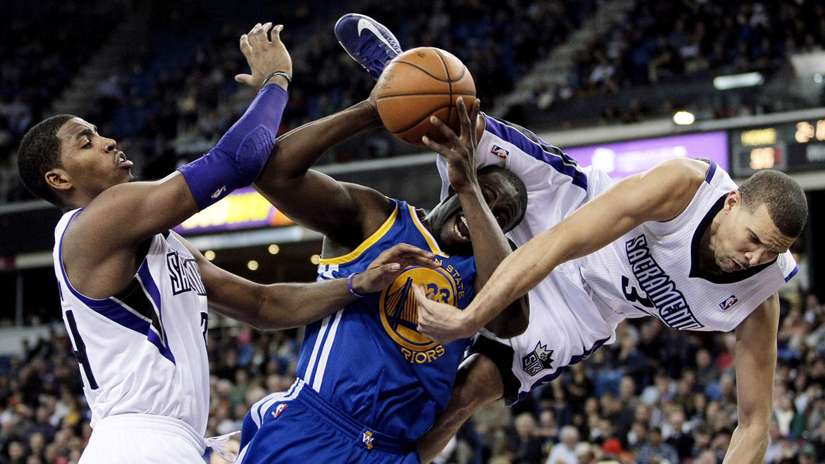 Sacramento Kings small forward Francisco Garcia (32) tries to prevent the shot against Golden State Warriors small forward Draymond Green (23) with Sacramento Kings power forward Jason Thompson (34) during the second quarter at Sleep Train Arena.