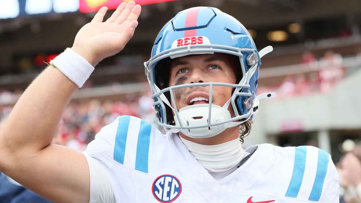 Ole Miss Rebels quarterback Jaxson Dart (2) celebrates after a touchdown in the third quarter against the Arkansas Razorbacks at Donald W. Reynolds Razorback Stadium. Mississippi won 63-31.