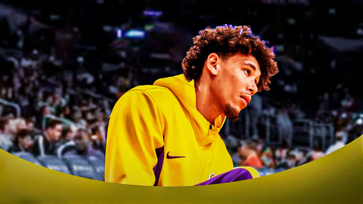 Lakers Jaxson Hayes sitting down on an NBA sideline looking serious