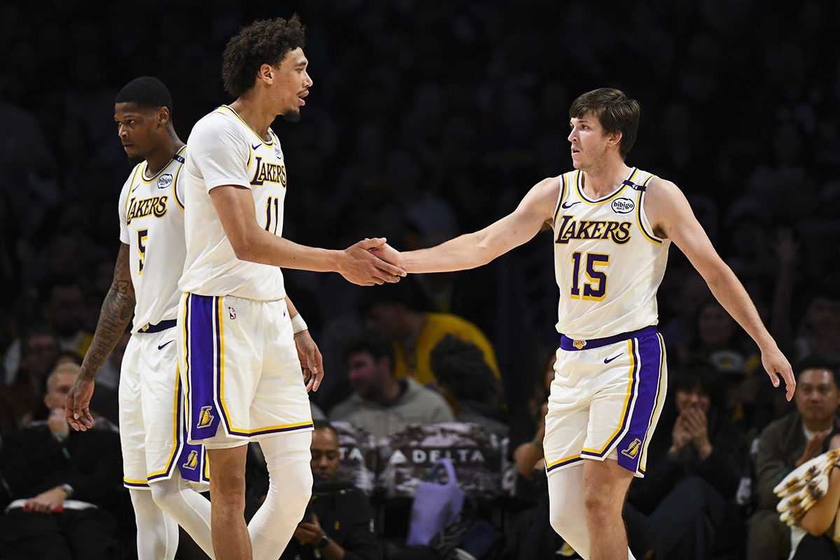 Los Angeles Lakers guard Austin Reaves (15) fives Los Angeles Lakers center Jaxson Hayes (11) after scoring against the Toronto Raptors during the second half at Crypto.com Arena.