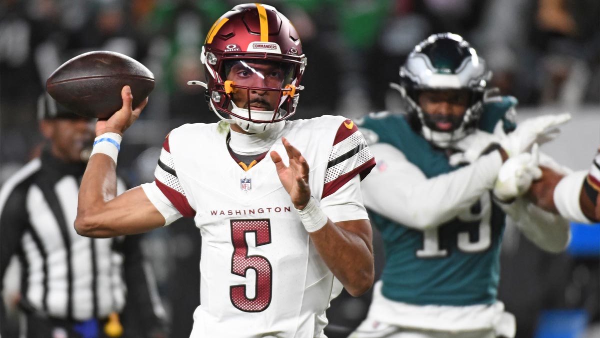 Washington Commanders quarterback Jayden Daniels (5) throws a pass during the fourth quarter against the Philadelphia Eagles at Lincoln Financial Field.