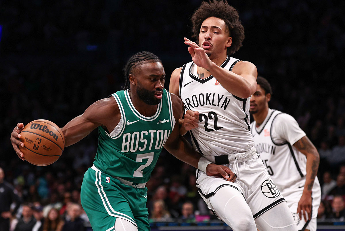 Boston Celtics Guard Jailen Brown (7) Drive to Cart as Brooklyn Networks Net Jalen Wilson (22) Defining in the center of Barclays during the first half.