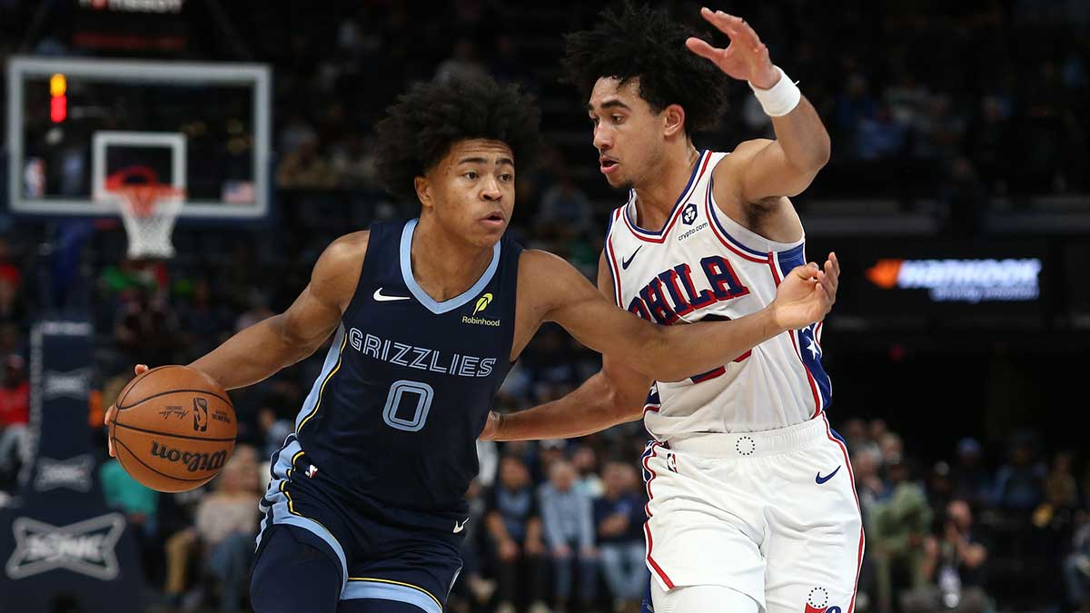 Memphis Grizzlies forward Jaylen Wells (0) drives to the basket as Philadelphia 76ers guard Jared McCain (20) defends during the second half at FedExForum.