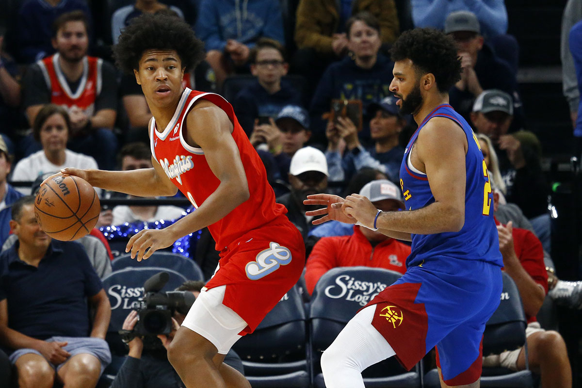 Memphis Grizzlies forward Jaylen Wells (0) dribbles as Denver Nuggets guard Jamal Murray (27) defends during the first half at FedExForum.