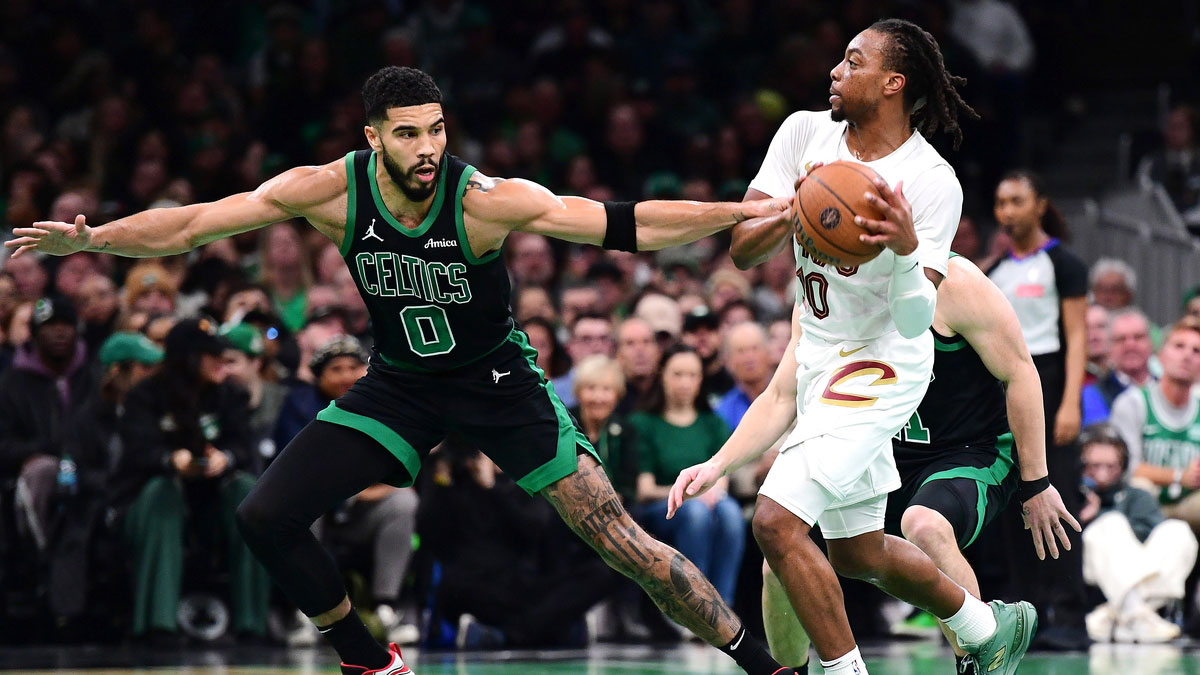 Boston Celtics forward Jayson Tatum (0) defends Cleveland Cavaliers guard Darius Garland (10) during the first half at TD Garden.