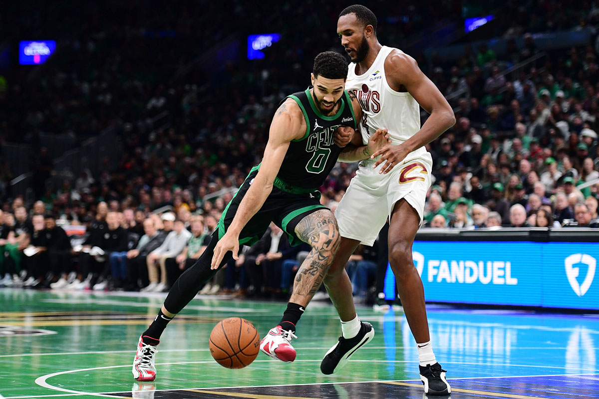 Boston Celtics forward Jayson Tatum (0) drives to the basket while Cleveland Cavaliers forward Evan Mobley (4) defends during the first half at TD Garden. 