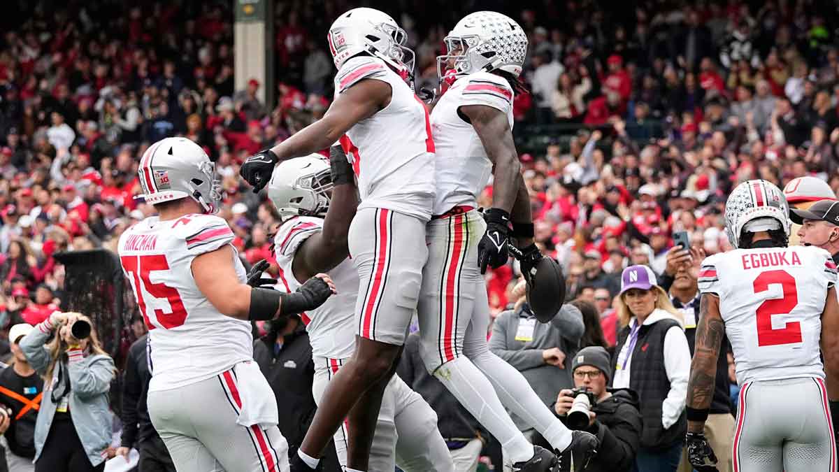 Ohio State Buckeyes tight end Jelani Thurman (15) celebrates a catch by wide receiver Jeremiah Smith (4) during the NCAA football game against the Northwestern Wildcats at Wrigley Field