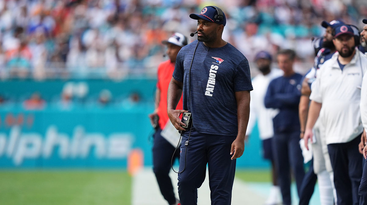 New England Patriots head coach Jerod Mayo walks down the sideline during the first half against the Miami Dolphins at Hard Rock Stadium.