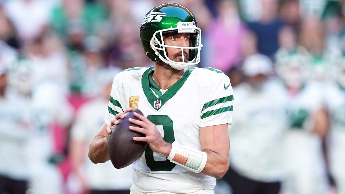 New York Jets quarterback Aaron Rodgers (8) passes against the Arizona Cardinals during the second half at State Farm Stadium