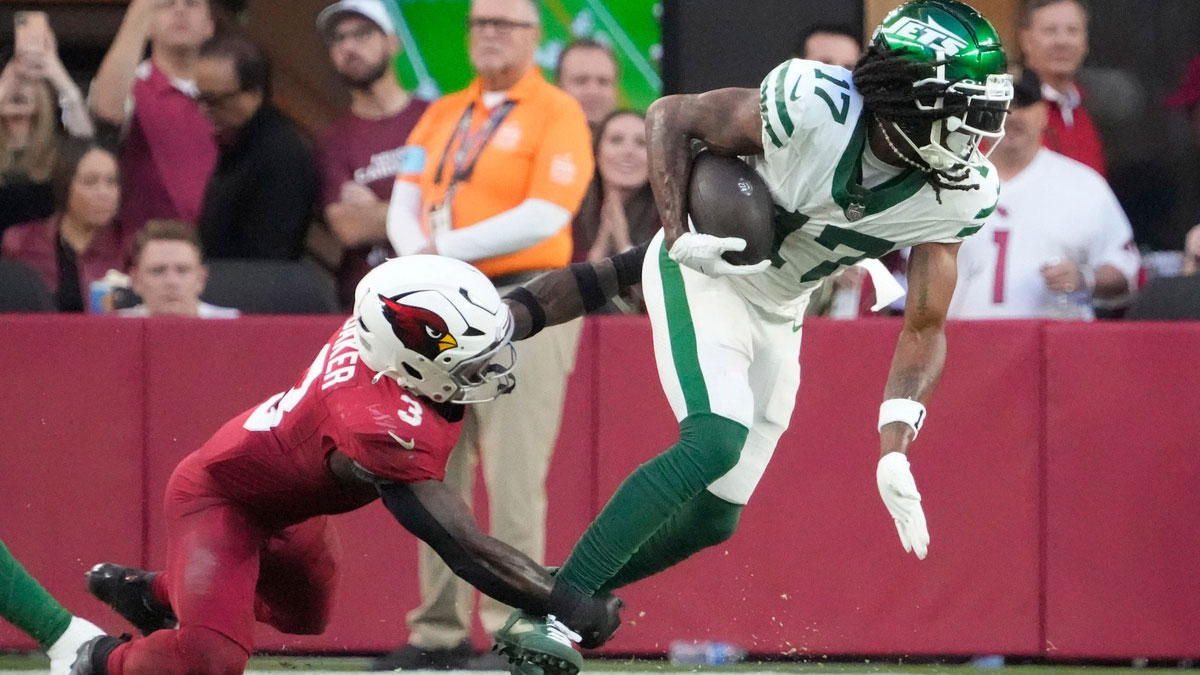 New York Jets wide receiver Davante Adams (17) is tackled by Arizona Cardinals safety Budda Baker (3)