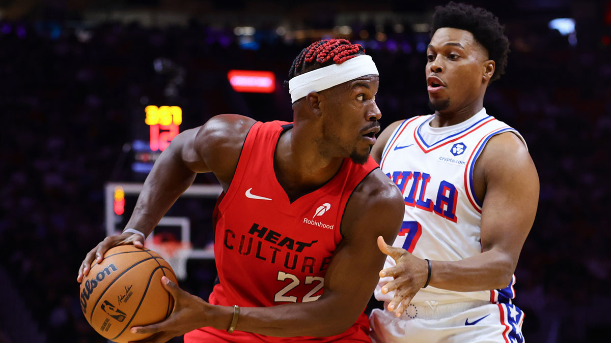 Miami Heat forward Jimmy Butler (22) protects the basketball from Philadelphia 76ers guard Kyle Lowry (7) during the second quarter at Kaseya Center.