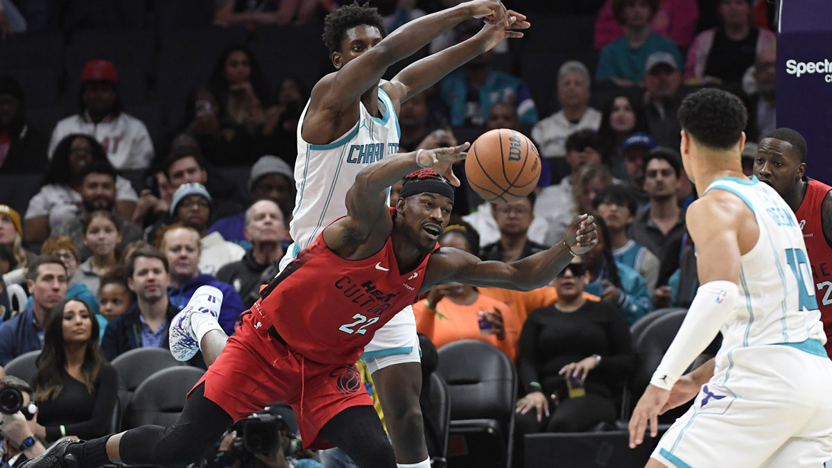 Miami Heat forward Jimmy Butler (22) goes after a loose ball during the first half against the Charlotte Hornets at the Spectrum Center.